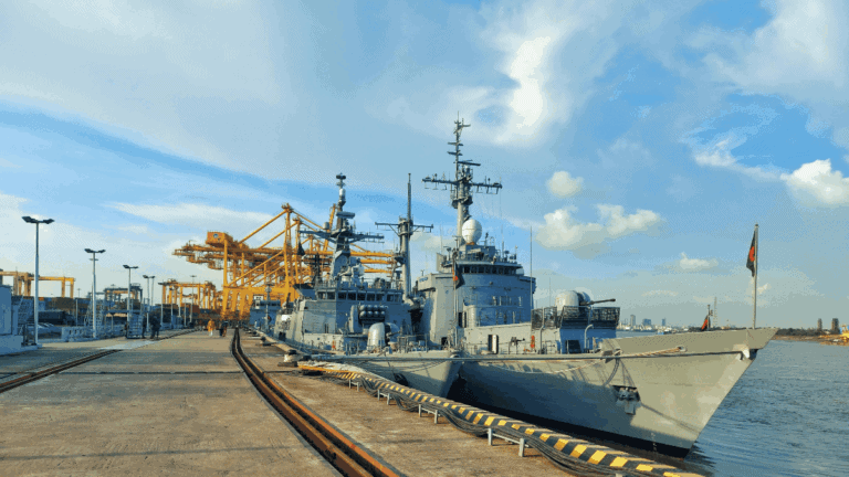 Military ships docked at harbor