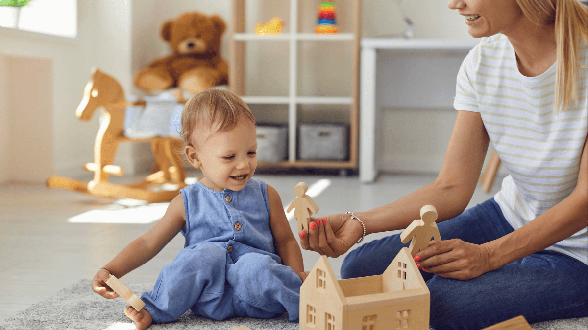 a grown woman plays with a child