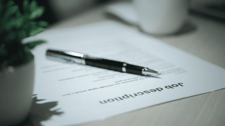 an artistic shot of a piece of paper titled job description