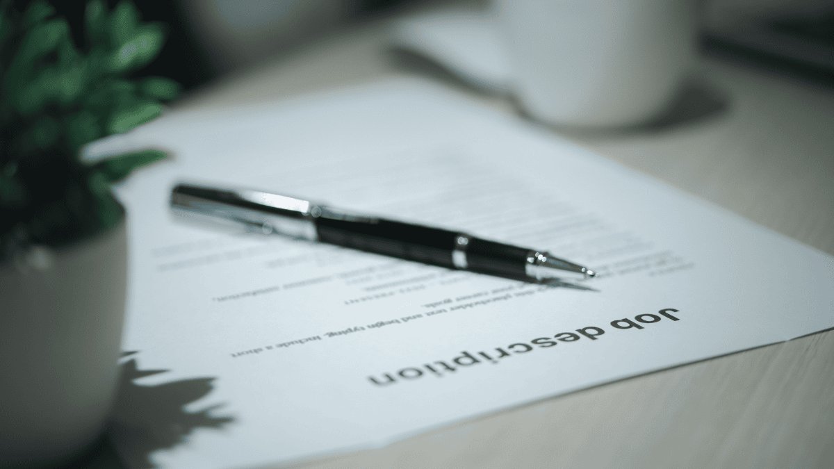an artistic shot of a piece of paper titled job description