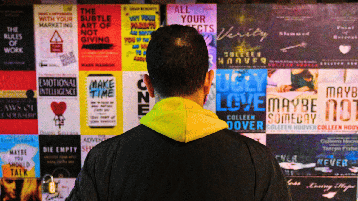 person standing in front of a poster