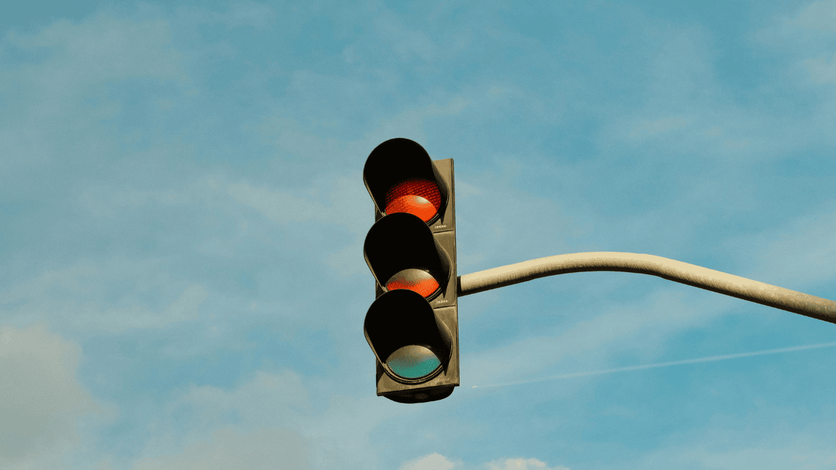 a traffic light on a background of blue sky